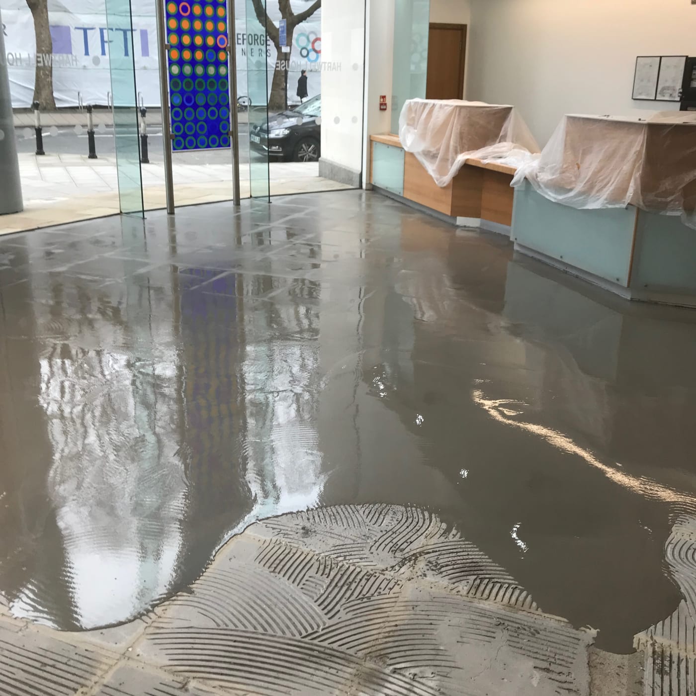 Applying Self Levelling Screed During Commercial Tiling